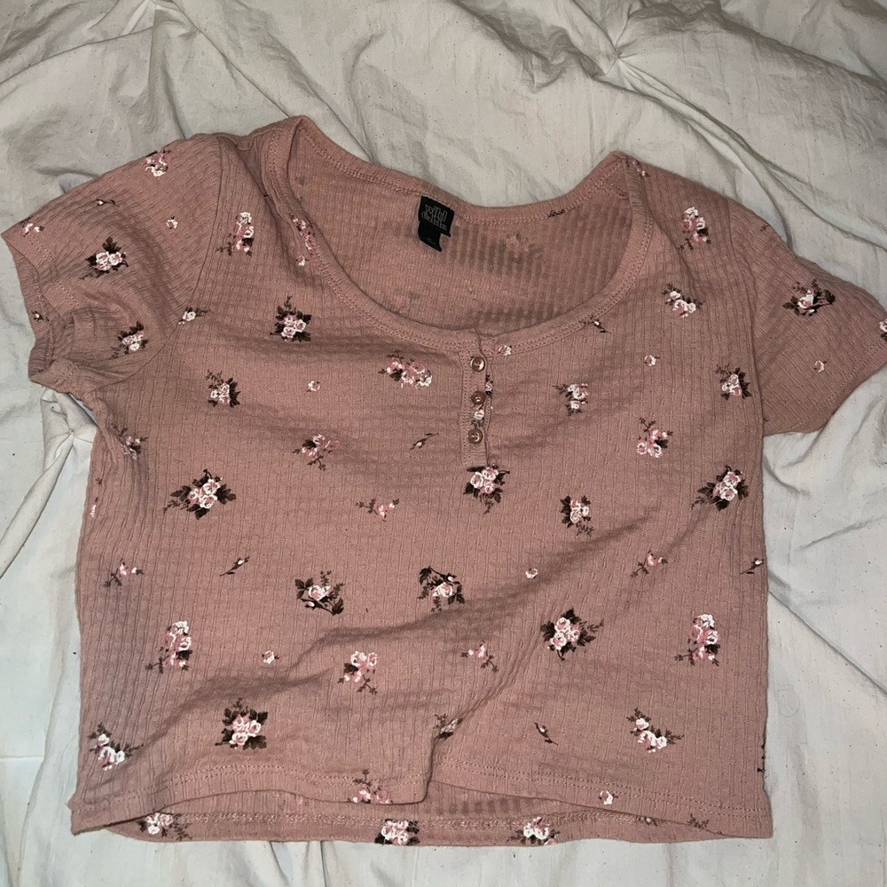 Pink top with flowers.